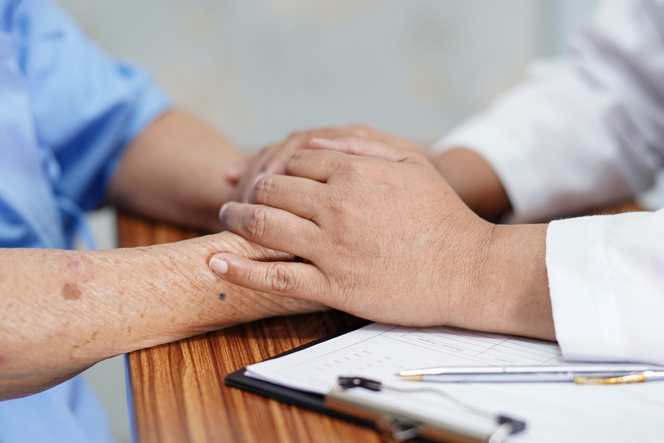 Holding Touching hands Asian senior or elderly old lady woman patient with love, care, helping, encourage and empathy at nursing hospital ward : healthy strong medical concept